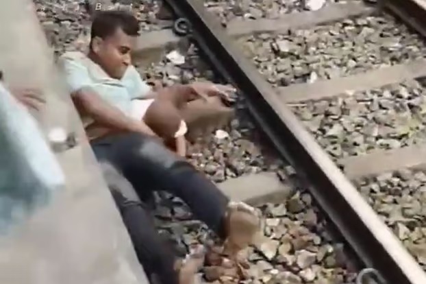 ট্রেনের নিচে শিশুকে জড়িয়ে প্রাণরক্ষা বাবার